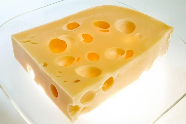 Ein Stück Käse Mit Löchern — Stockfoto