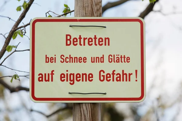 Sign German Saying Entering Snowy Icy Conditions Your Own Risk — Stock Photo, Image