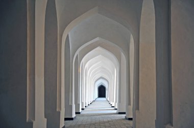 Bukhara: white corridor of madrassah clipart