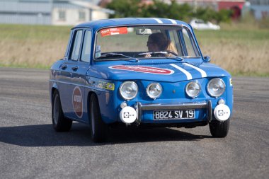 Renault 8 on a circuit. clipart