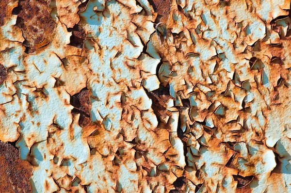 Rusted metallic surface and flaky paint — Stock Photo, Image