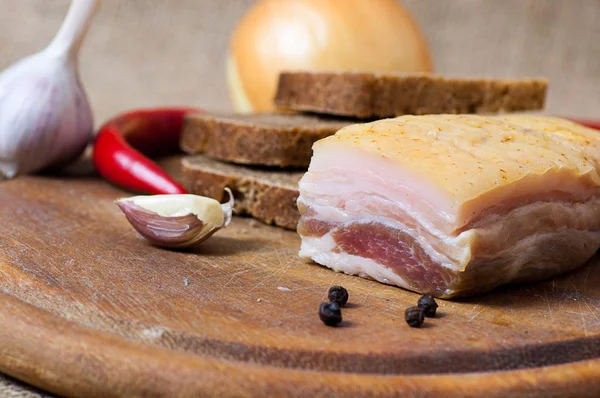 Salted Fatback (streak of lean) on cutting board — Stock Photo, Image