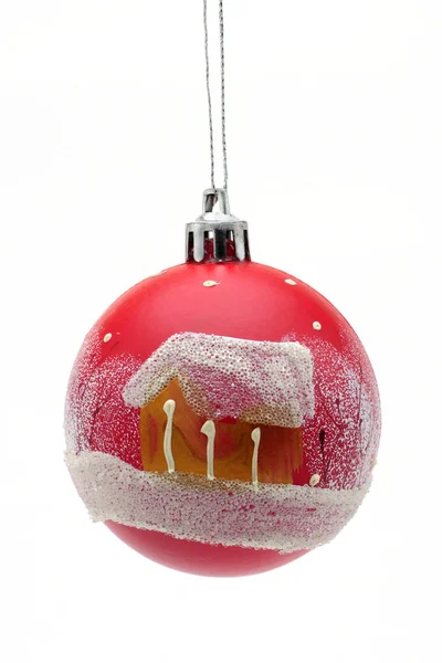 Red ball with a house Christmas and New Year toy on a white back — Stock Photo, Image