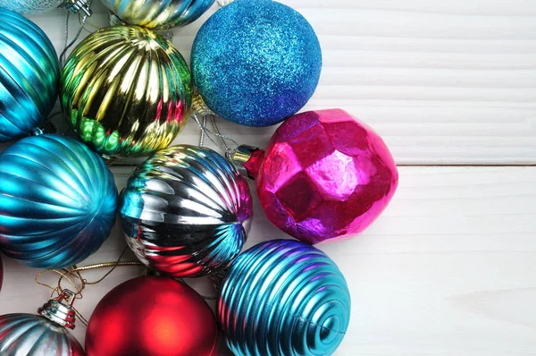 Christmas and New Year`s balls of shiny color on a white backgro — Stock Photo, Image
