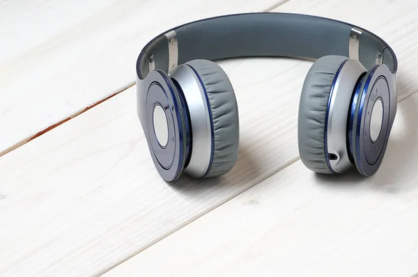 Blue Silver Modern Headphones Listening Music White Wooden Background — Stock Photo, Image