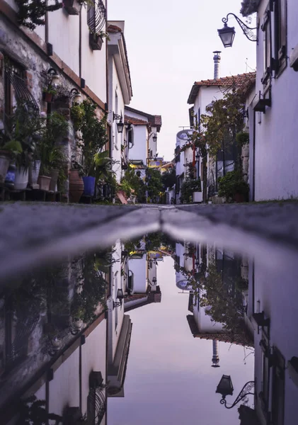 Reflection of narrow street in water. Slow city Izmir Seferihisar. Reflection of Kaleici streets in water.