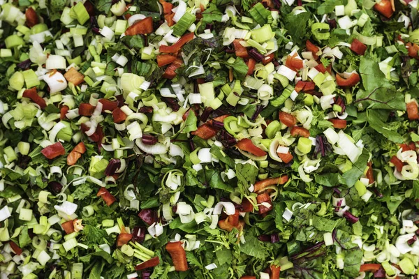 Mixed vegetables such as chopped leek, red pepper and spinach. Vegetables for cooking.