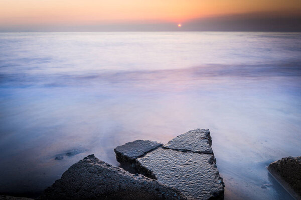 Rock on the beach in the morning at Chonburi, Thailand.