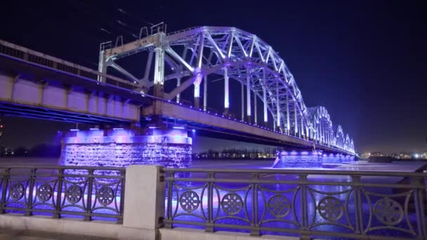 Night Riga city winter timelapse, lights, bridge, Daugava river — Stock Video