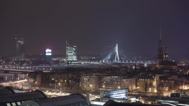 Night Riga city winter timelapse, lights, bridge, Daugava river — Stock Video