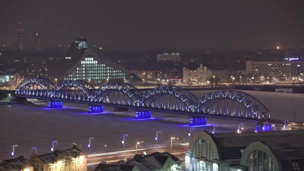 Night Riga city winter timelapse, lights, bridge, Daugava river — Stock Video