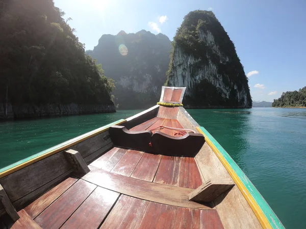 Tropical Thai jungle lake Cheo lan wood boat, wild mountains nature national park ship yacht rocks