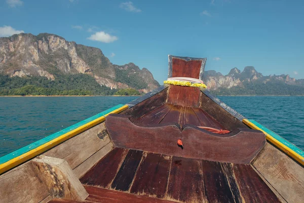 Tropical Thai jungle lake Cheo lan wood boat, wild mountains nature national park ship yacht rocks