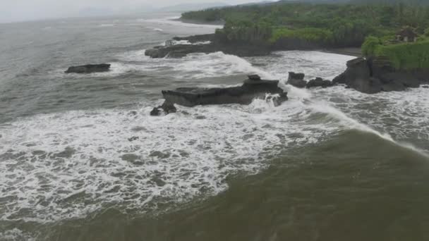 Waves breaking on the rocks on Bali Island Beach 4K Drone flight — Stock Video