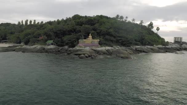 Gold Buddha statue on the Island near to Phuket, 4K Drone flight — Stock Video