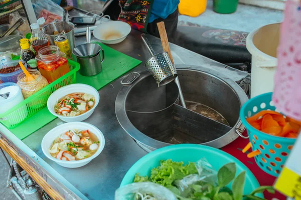 Street kitchen Pork soup with with noodles and herbs in Asia — Stock Photo, Image