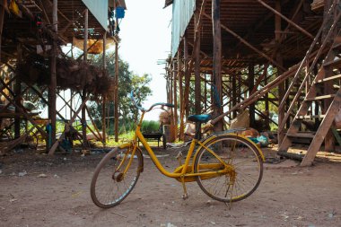 Classic vintage Bicycle in Cambodian Floating Village near Tonle Sap Lake clipart