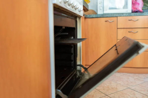 Opening the gas oven in kitchen while baking and cooking — Stock Photo, Image