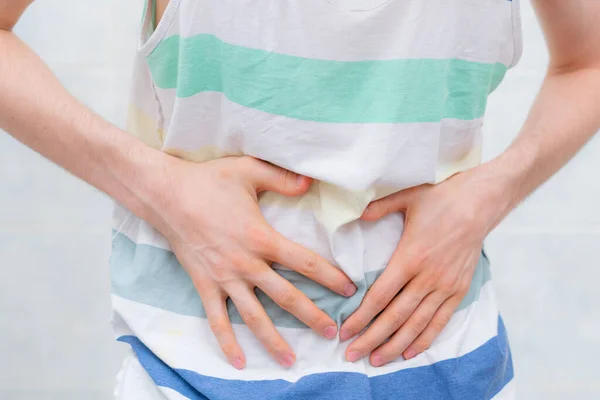 Man feeling awful stomach ache, touching the body s — Stock Photo, Image