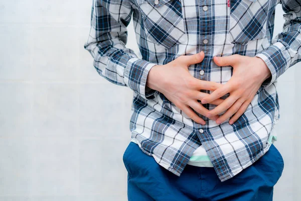 Man feeling awful stomach ache, touching the body s — Stock Photo, Image