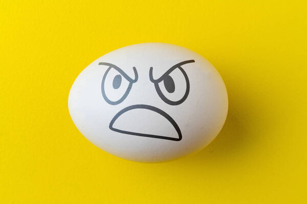 evil scary angry face emotion painted on the easter egg, halloween concept