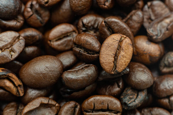 macro of roasted coffee beans background, the texture pattern