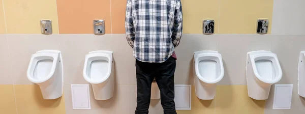 Young Man Public Toilet Standing Next Urinal Trade Center — Stock Photo, Image