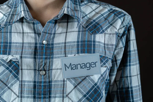 Male Employee Holding Badge Text Manager Word His Shirt — Stock Photo, Image