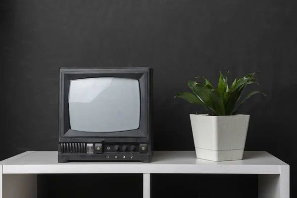 Old fashioned vintage tv television on the shelf at home — Zdjęcie stockowe