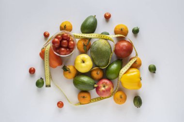 mix of various raw fruit flat lay with a centimeter, the diet concept