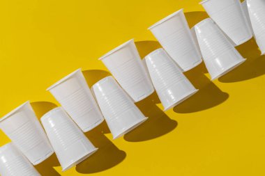 a fastfood white plastic cups, empty abstract plastic dishware