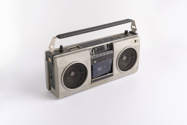 Abstract retro simple radio cassette recorder isolated on color background, simple music listen on the party