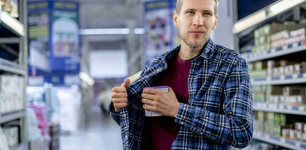 Kleptomania Concept Man Grocery Store Stealing Food Put Pocket — Stock Photo, Image