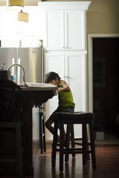 Side View Boy Studying Homework Kitchen — Stock Photo, Image
