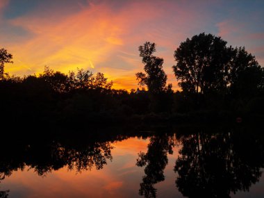 Red sky over idyllic Ruhr valley in Muelheim in the evening