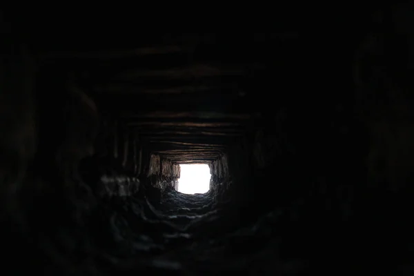 Looking through a hole through the wall at Asinelli Tower in Bologna, Italy — Stock Photo, Image