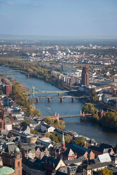 Aerial of river Main in Frankfurt, Germany with bridges and Deutschherrnufer on the right bank of the water