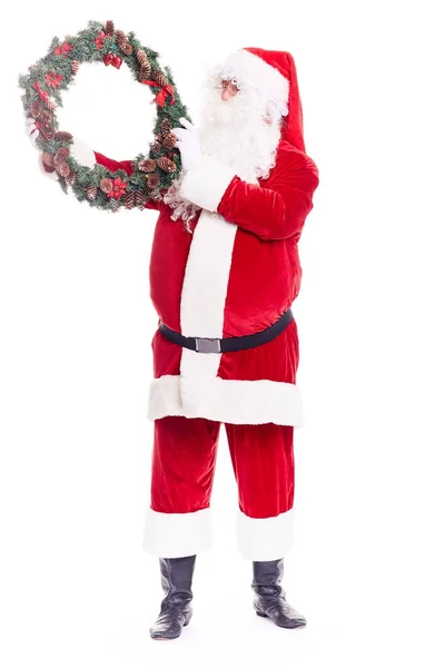 Weihnachtsmann mit Weihnachtskranz — Stockfoto