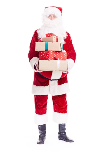 Weihnachtsmann mit vielen Geschenken — Stockfoto