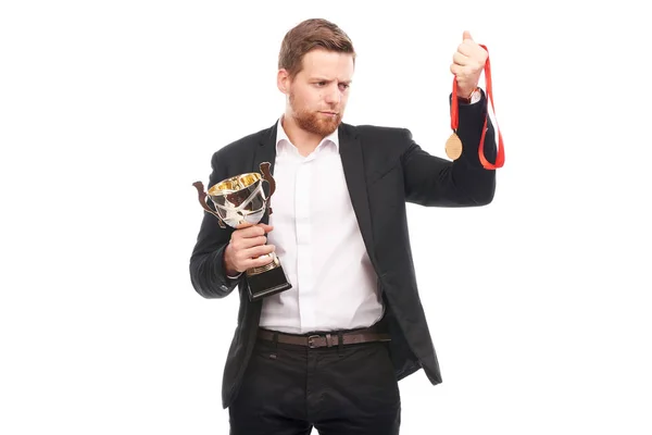 Podnikatel držící trofej — Stock fotografie