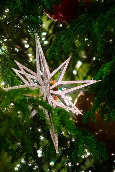 Closeup Sparkle Star Decorates Christmas Tree Green Lights Christmas Decorations — Stock Photo, Image