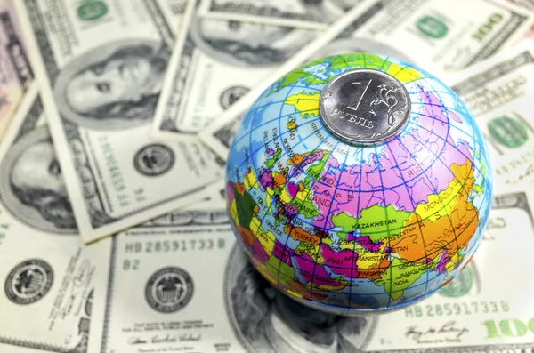 Globe on a pile of dollars planet earth a lot of money