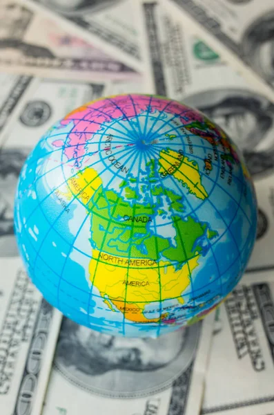 Globe Pile Dollars Planet Earth Lot Money Royalty Free Stock Images