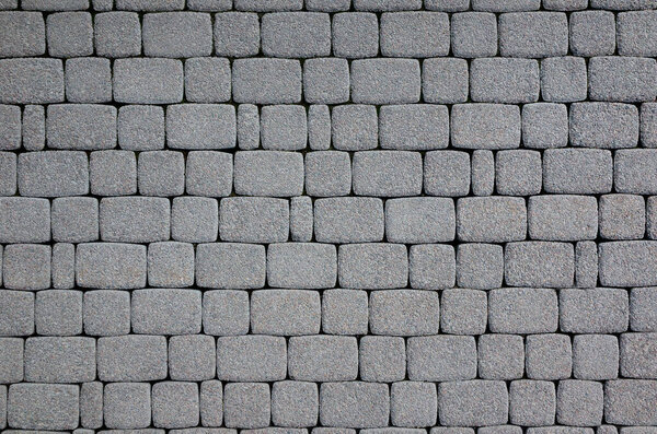 Grey paving pavement stacked on the footpath texture background