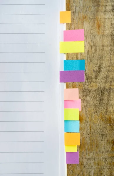 Blank note book with colorfull post it on wood table — Stock Photo, Image