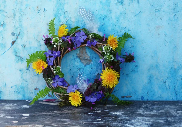 easter background with spring wreath on the blue wall