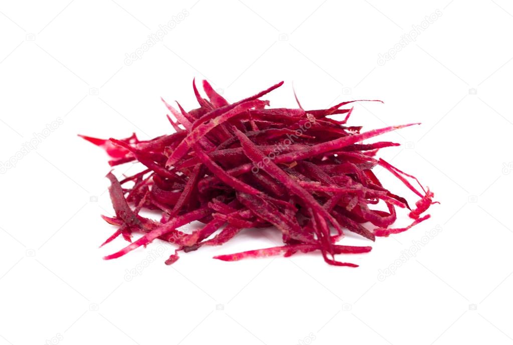 grated beets on a white background