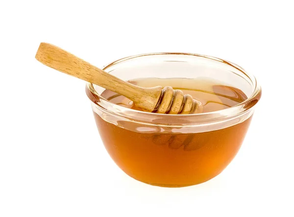 Houten honingdipper met honing geïsoleerd op witte achtergrond — Stockfoto