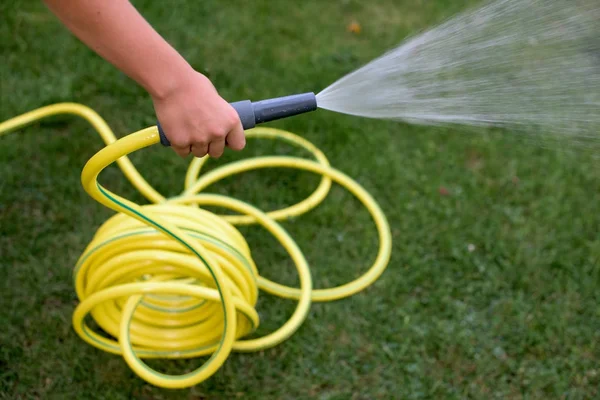 Yellow pastic hose pipe — Stock Photo, Image