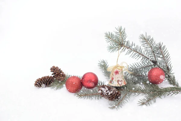 Christmas bell on the snow — Stock Photo, Image